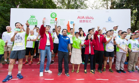 The Oxfam Trailwalker 2015 Kick-Off ceremony was officiated by Jacky Chan, Chief Executive Officer, AIA Hong Kong and Macau, Principal Sponsor of Oxfam Trailwalker 2015 (front row, fourth from the left), Syed Asim Hasan, Senior Vice President, State Street (front row, seventh from the left), Bernard Chan, Oxfam Trailwalker Advisory Committee Chair (front row, fifth from the left), and Trini Leung, Director General of Oxfam Hong Kong (front row, sixth from the left).